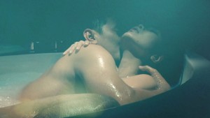 Lê Kiều Như trong một cảnh được xem là "rất nóng" trong phim Tình + tình